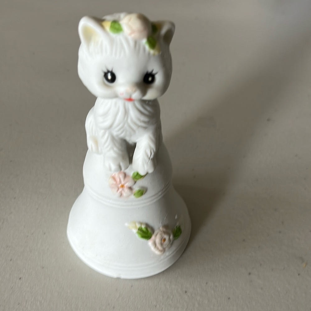 Vintage Porcelain White Cat Sitting On A Bell With Flowers